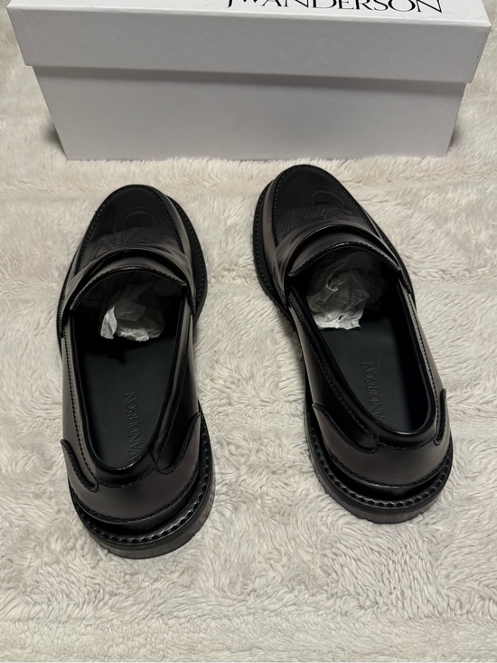 JW Anderson Black Embossed Logo Leather Penny Loafers main image 5